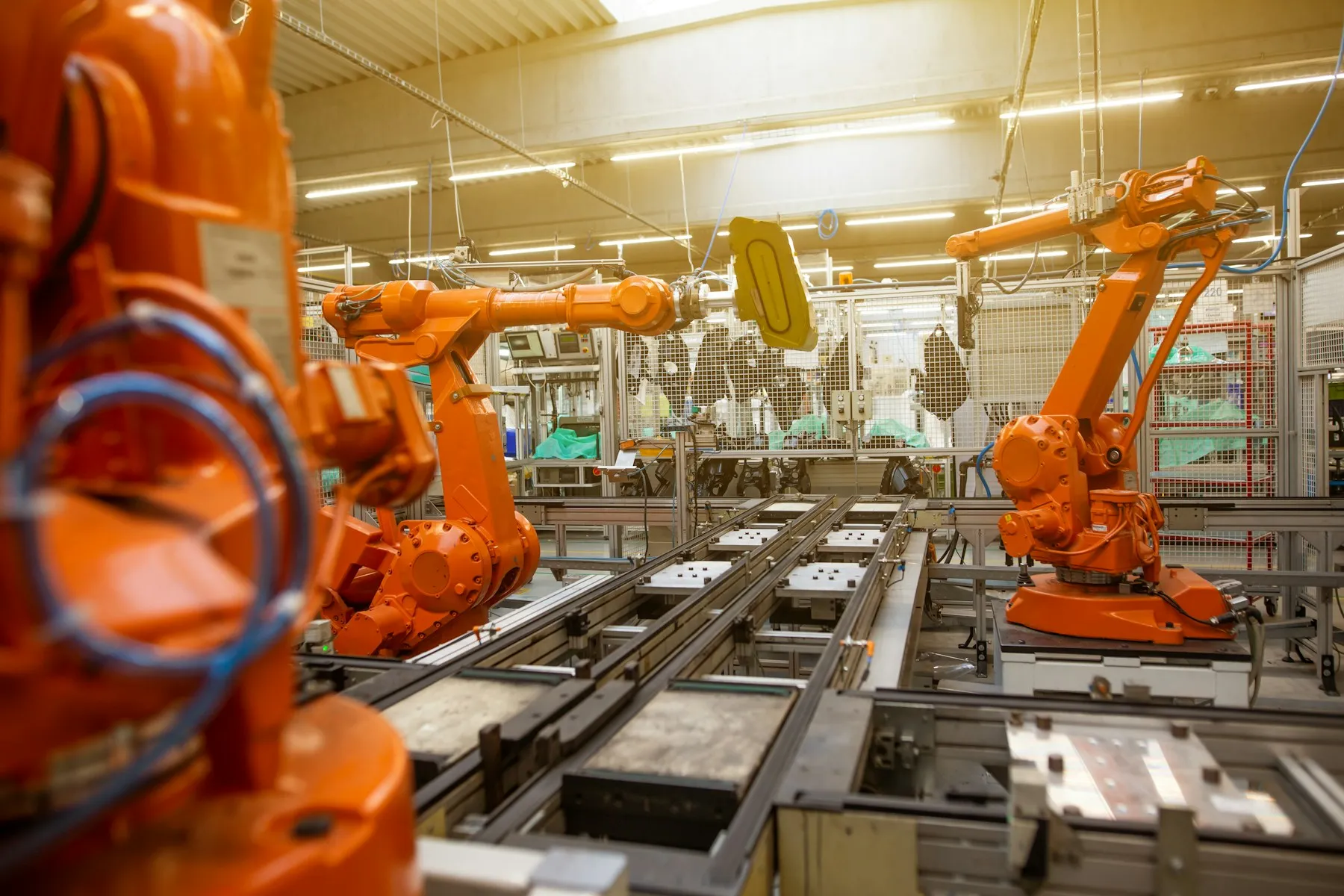 Industrial robots working across a modern manufacturing line